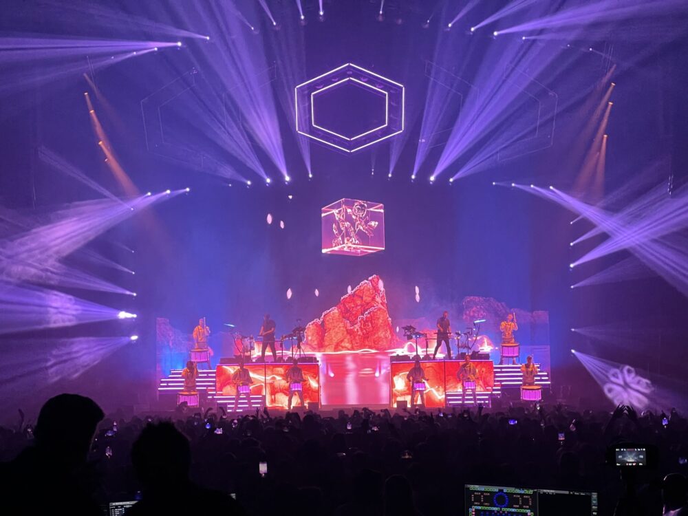 Odesza live show, with a Fvck Crystal on screen.